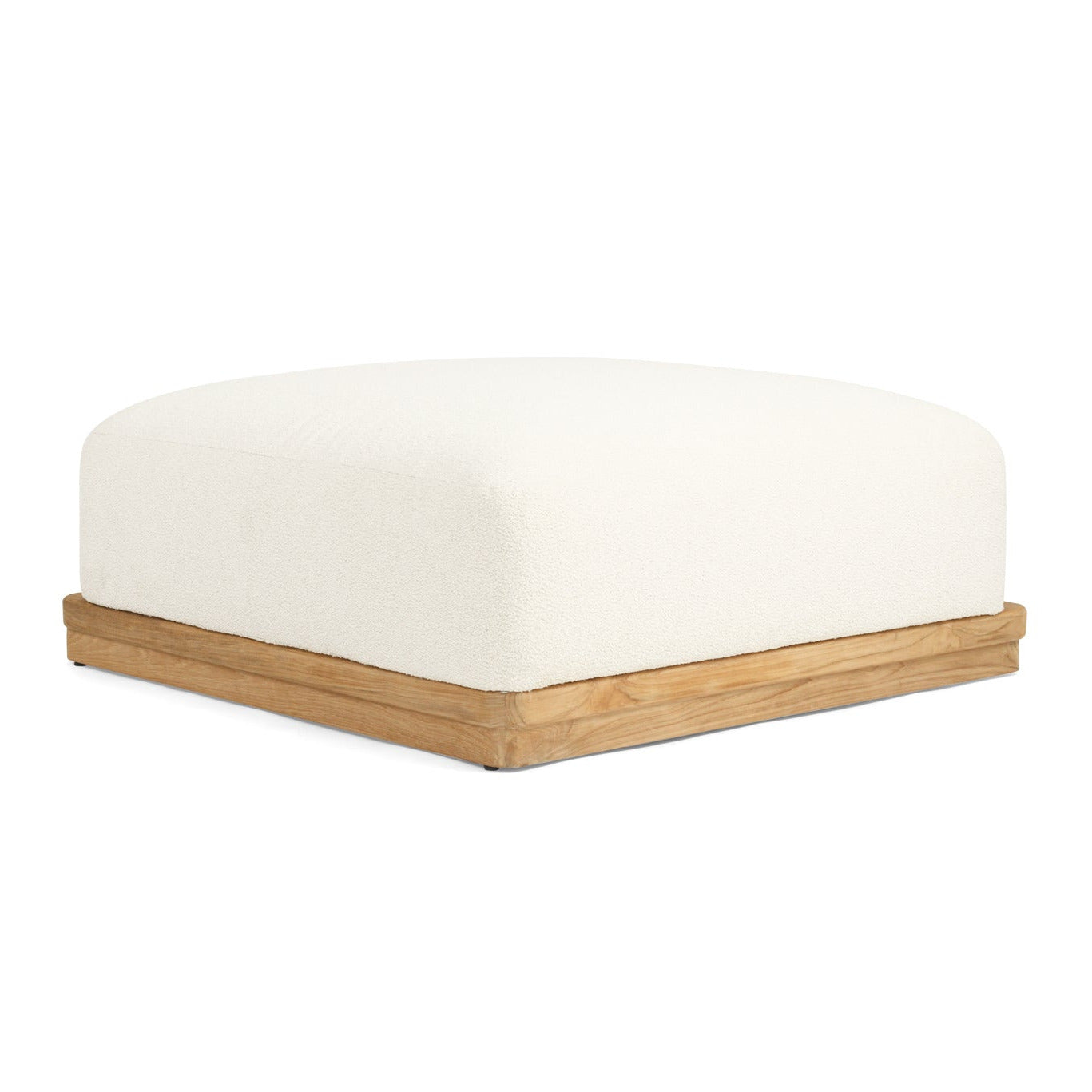 A square ottoman with a thick, cushioned off-white fabric top and a natural light wood base, shown from a three-quarters angle on a solid white background.