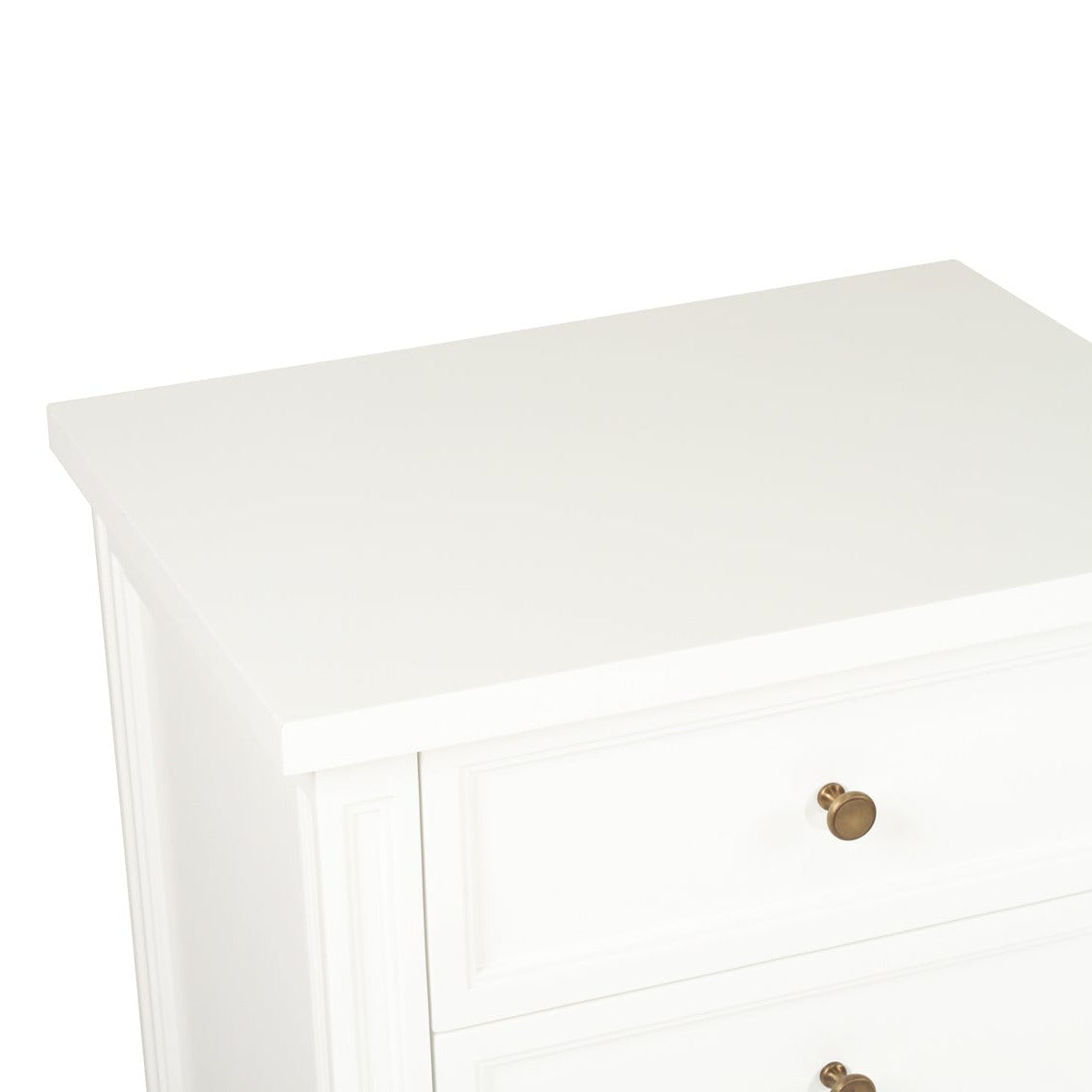 White rectangular object with a gold button on a white background