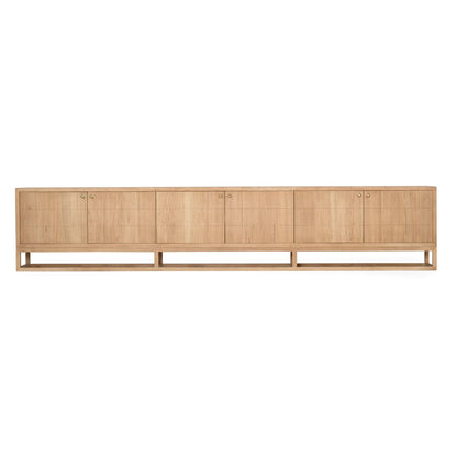 A long, low wooden sideboard or credenza with six cabinet doors, shown in a light natural oak finish against a plain white background.