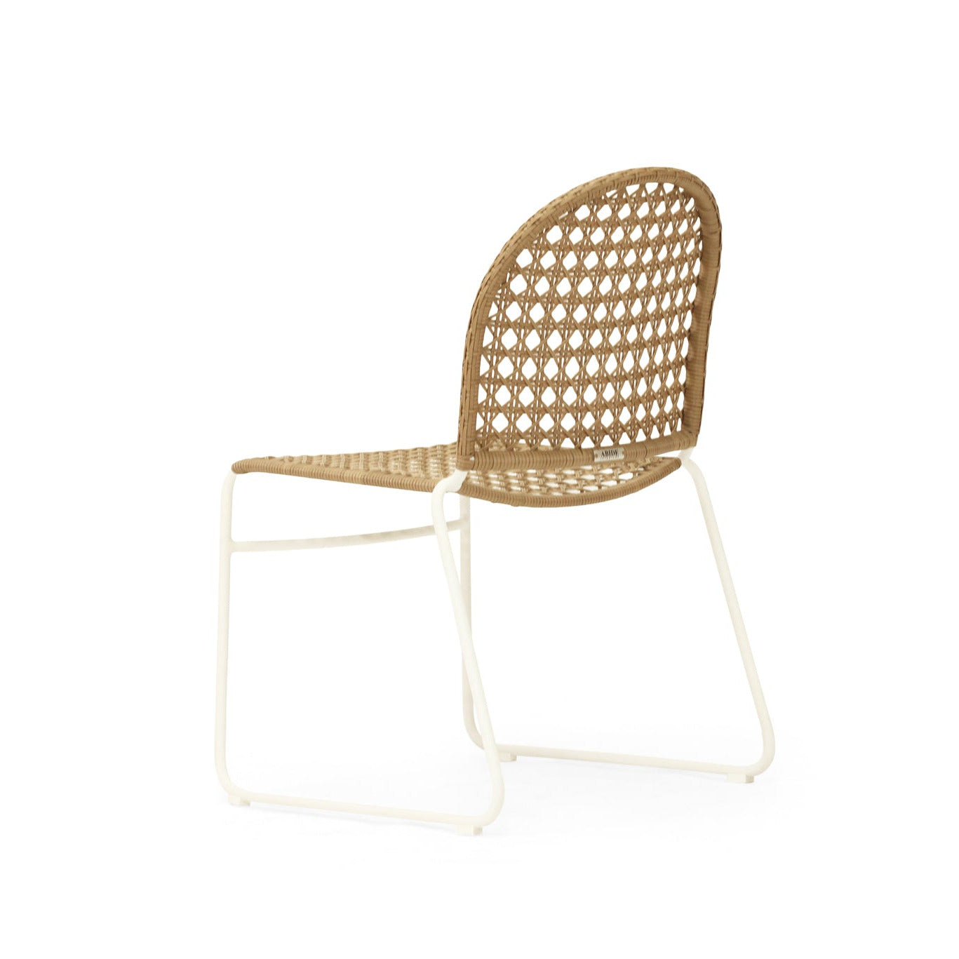 A modern side chair with a woven rattan seat and backrest on a white metal frame, shown against a plain white background.