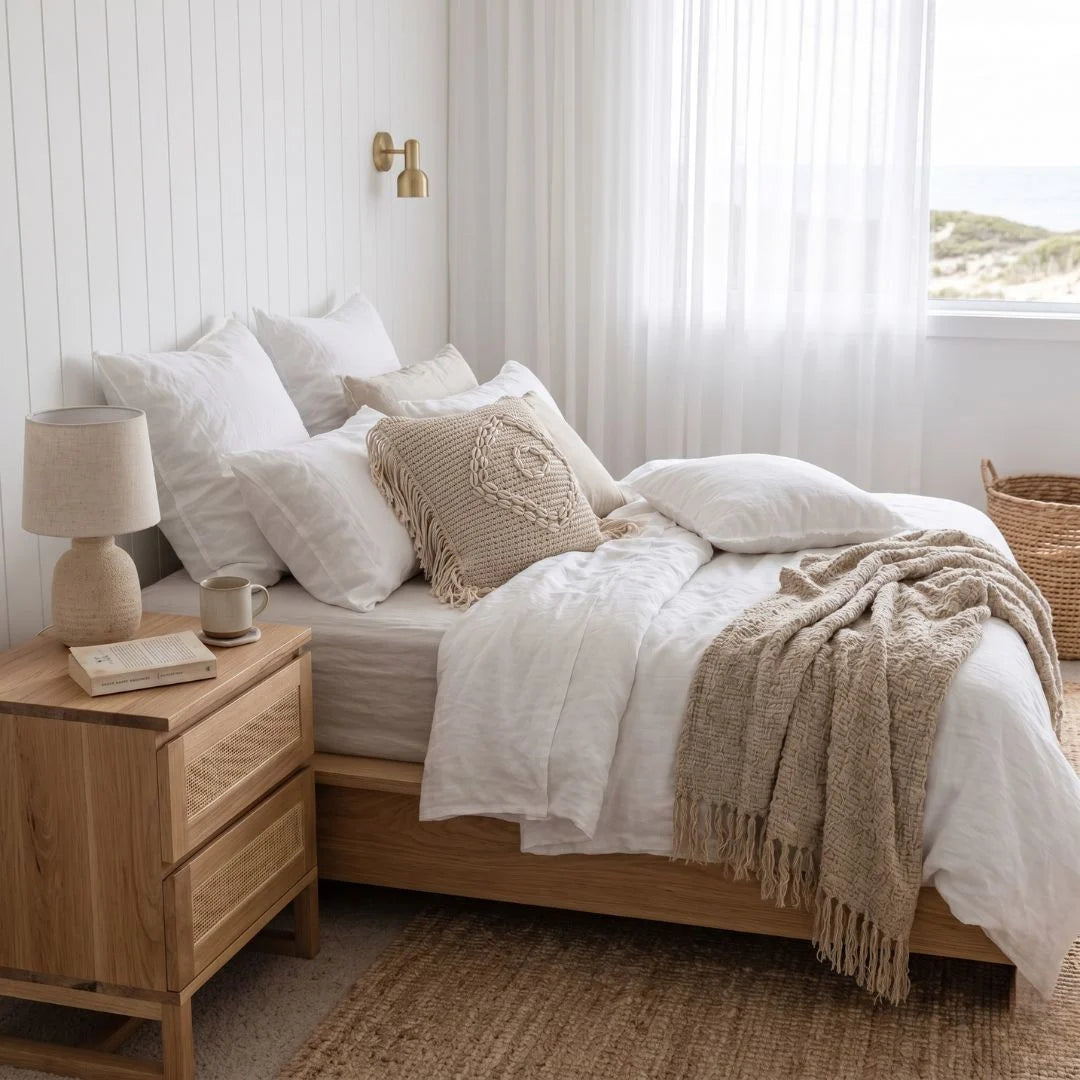 Kiera American Oak and Rattan Bedside Table in a modern bedroom
