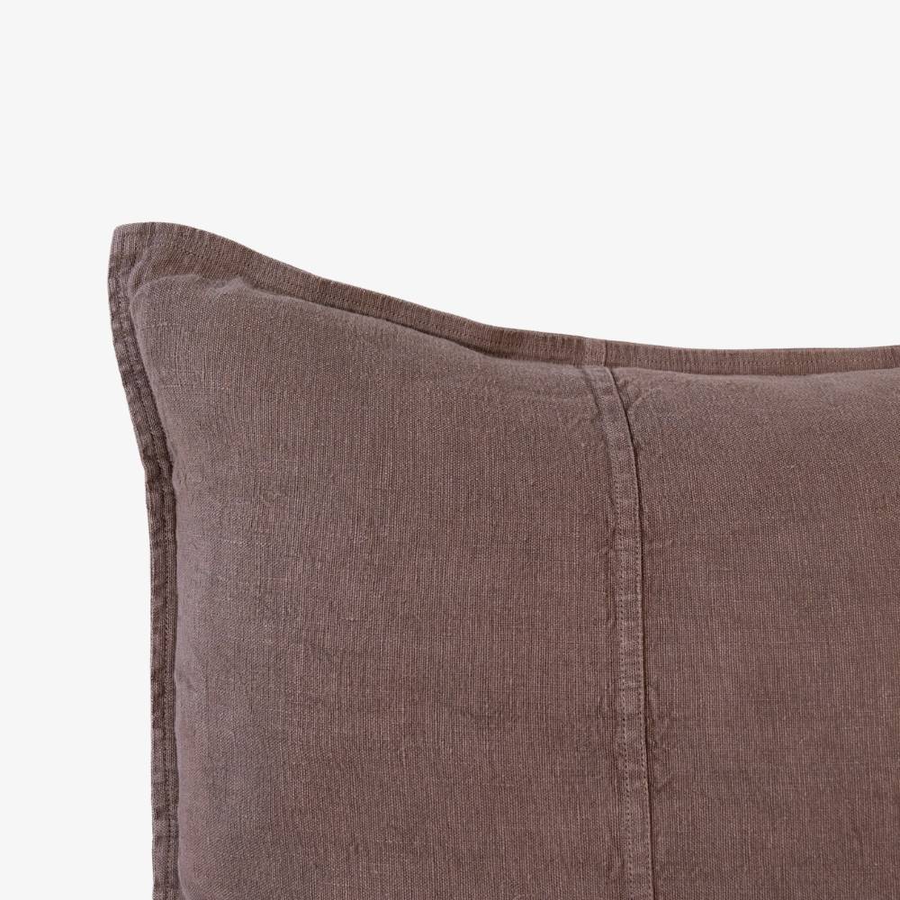 Brown textured pillow on a white background