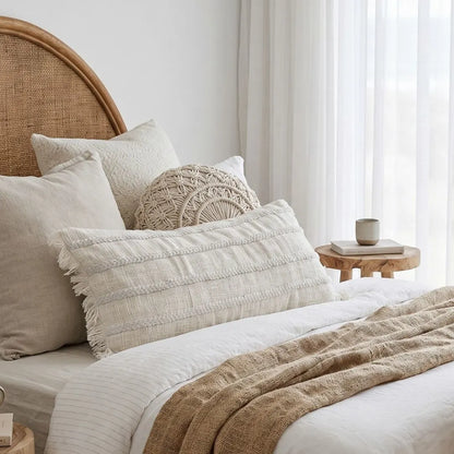Lulu long lumbar cushion styled in a modern coastal boho bedroom by sun republic