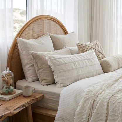 Lulu long lumbar cushion styled in a modern coastal boho bedroom by sun republic