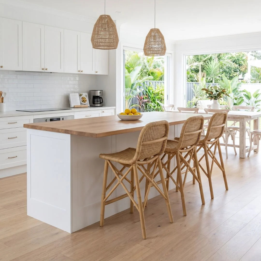 Sun Republic natural rattan counter stool at a modern coastal kitchen island bench