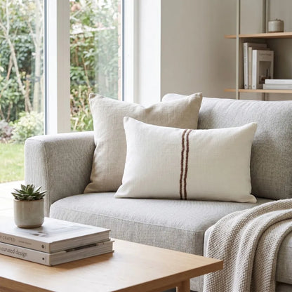 Gray sofa with decorative pillows in a living room setting