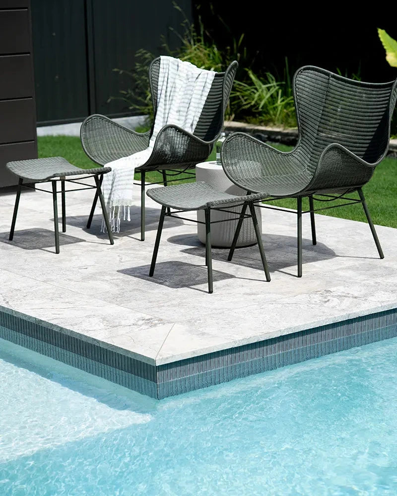 Outdoor patio furniture by a poolside