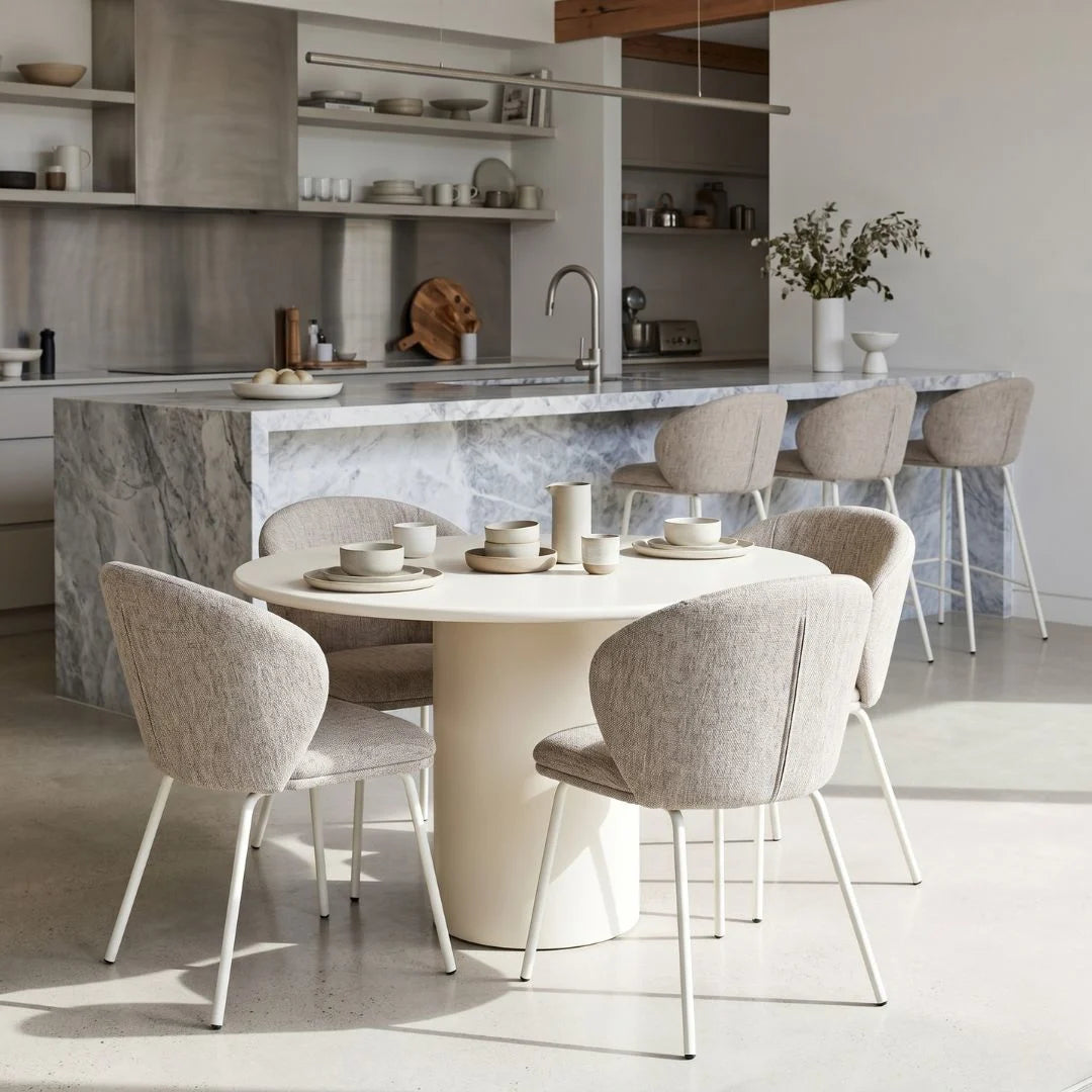 Modern kitchen with marble island and dining area