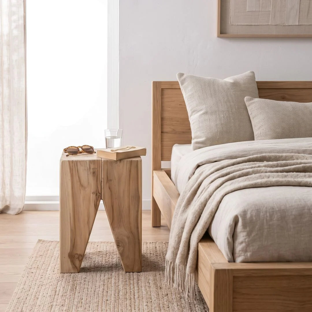 Square solid teak side table stump styled in a modern bedroom