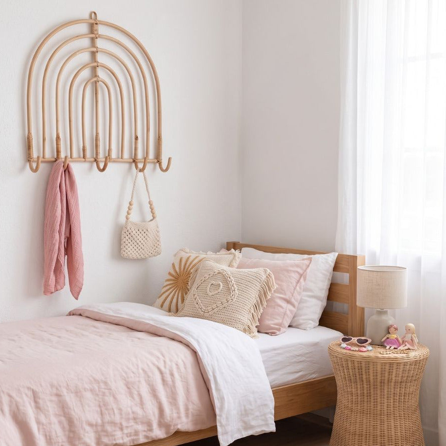 Sun Republic rainbow rattan wall hook styled in a bedroom