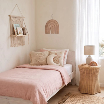 Sun Republic natural rattan decorative wall decor styled in a modern coastal boho girls bedroom 