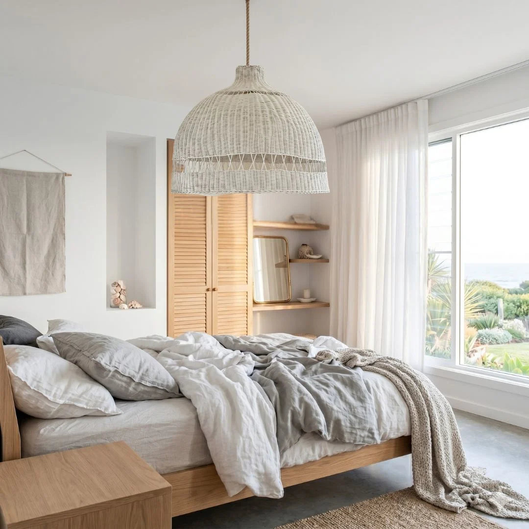 Modern bedroom with wooden bed, pendant light, and large window.