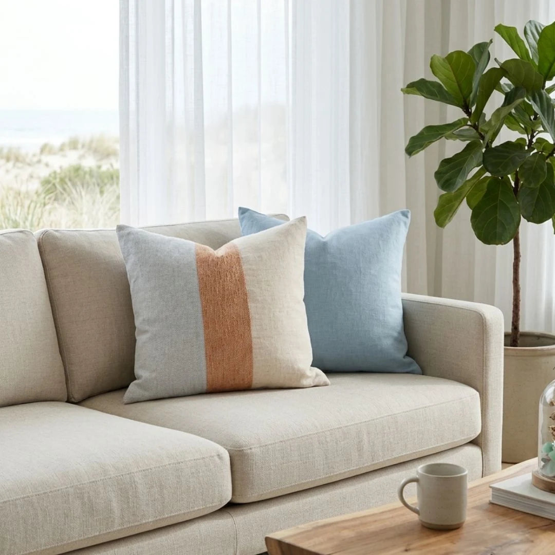 Sun Republic Tallow Cushion on a light coloured sofa