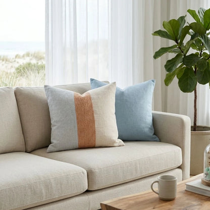 Sun Republic Tallow Cushion on a light coloured sofa