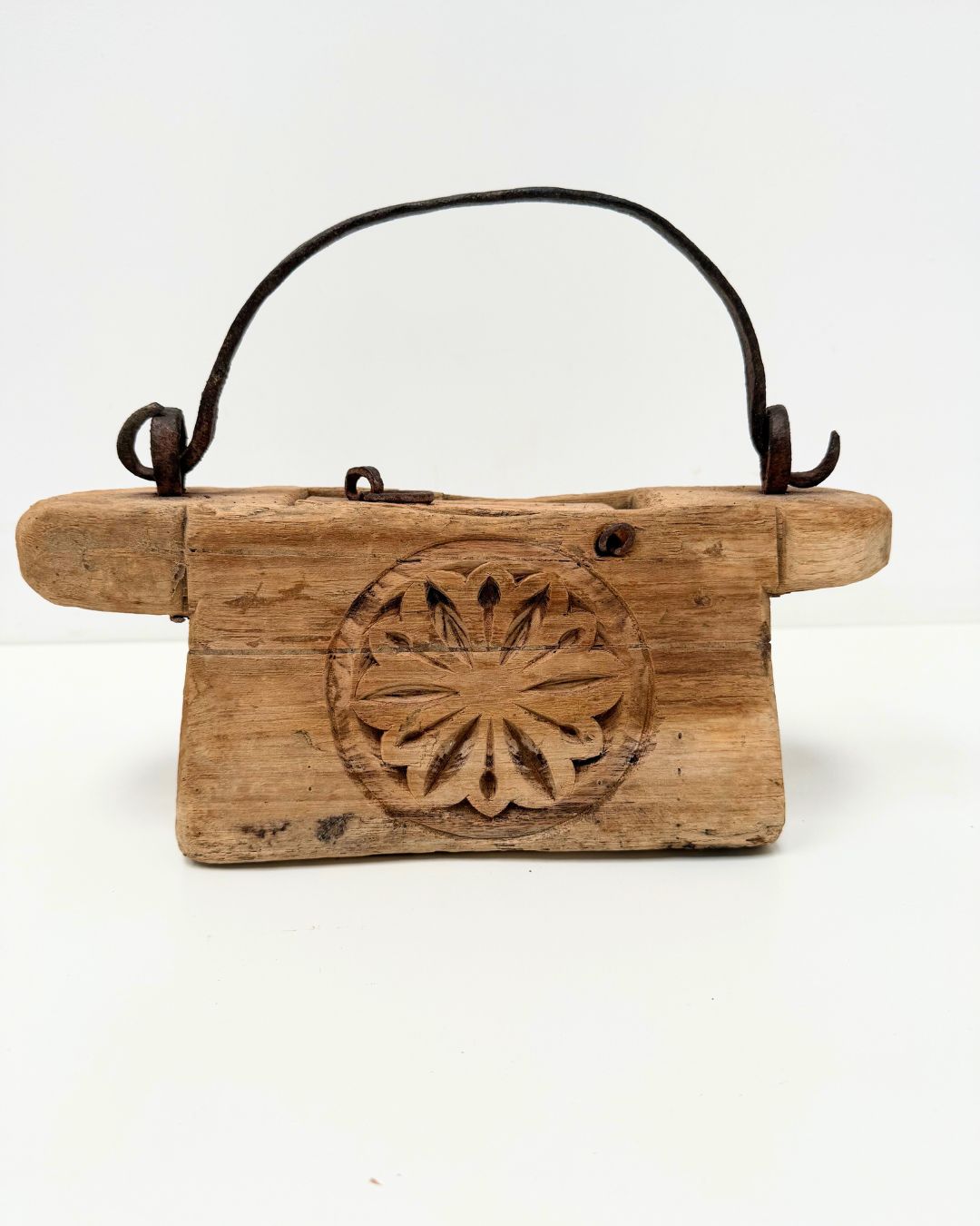 Vintage Indian Oil Pot with decorative carvings on a white background