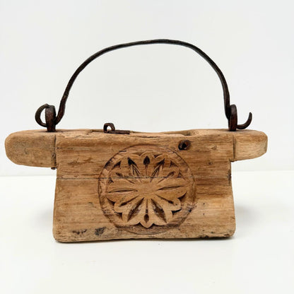 Vintage Indian Oil Pot with decorative carvings on a white background
