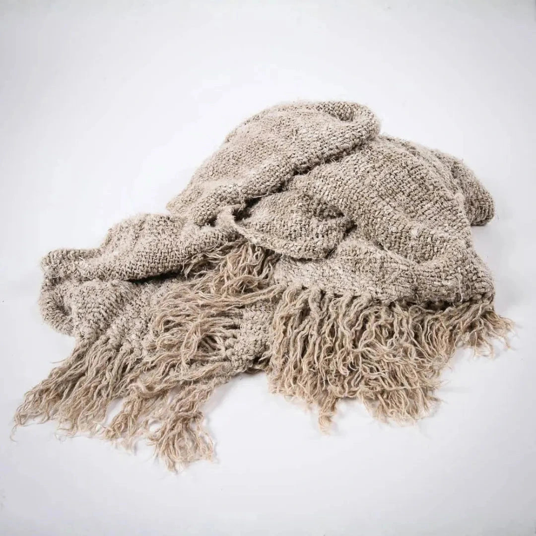 Beige textured throw blanket with tassels 