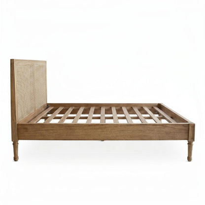 Wooden bed frame with woven headboard on a white background
