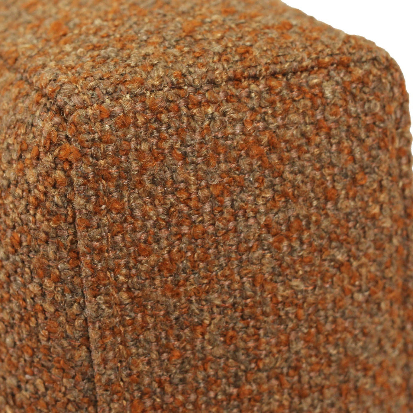 Close-up of a textured woven upholstery fabric in a heathered orange-brown and beige colorway, showing the weave detail and stitched seam.