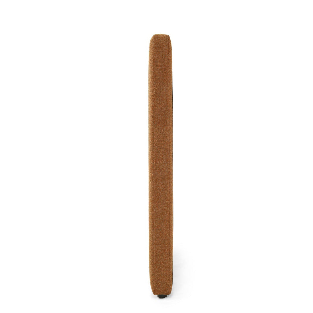 A rectangular upholstered headboard in a warm camel brown fabric, featuring vertical channel tufting, shown on a plain white background, side view angle.