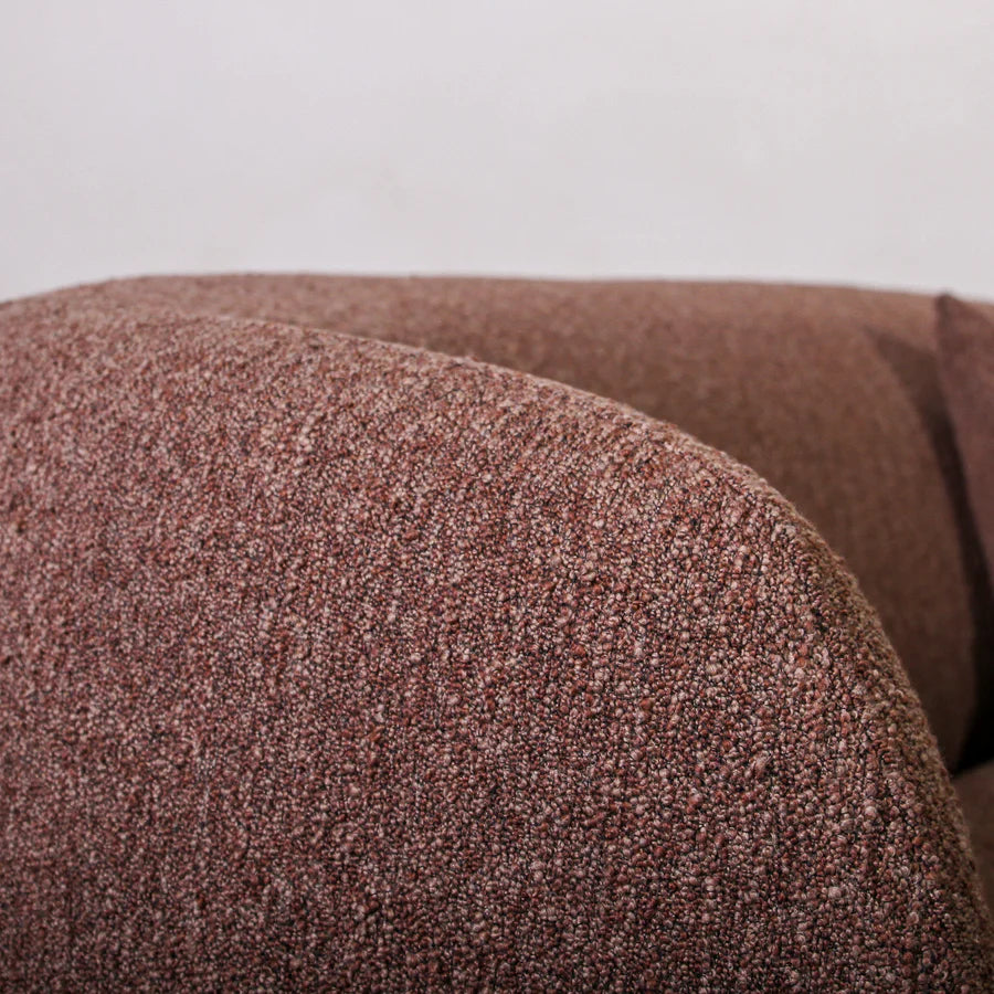 Close-up of a textured brown fabric surface