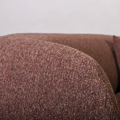 Close-up of a textured brown fabric surface