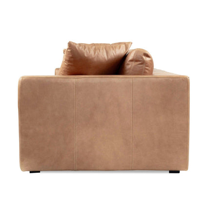 Tan brown saddle leather sofa with cushions on a white background from Sun Republic