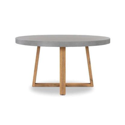A round dining table featuring a smooth gray concrete top and a natural light brown wooden base with angled legs and a central crossbar, shown on a plain white background.