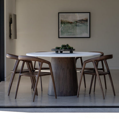 Dining area with a modern table and chairs in a well-lit room.