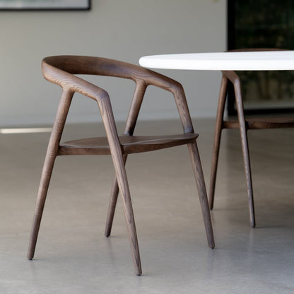 Wooden chair and dining table in a modern interior setting