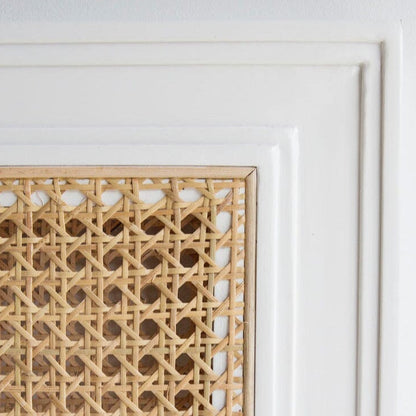 Square bedhead with white frame and woven natural material on a white background