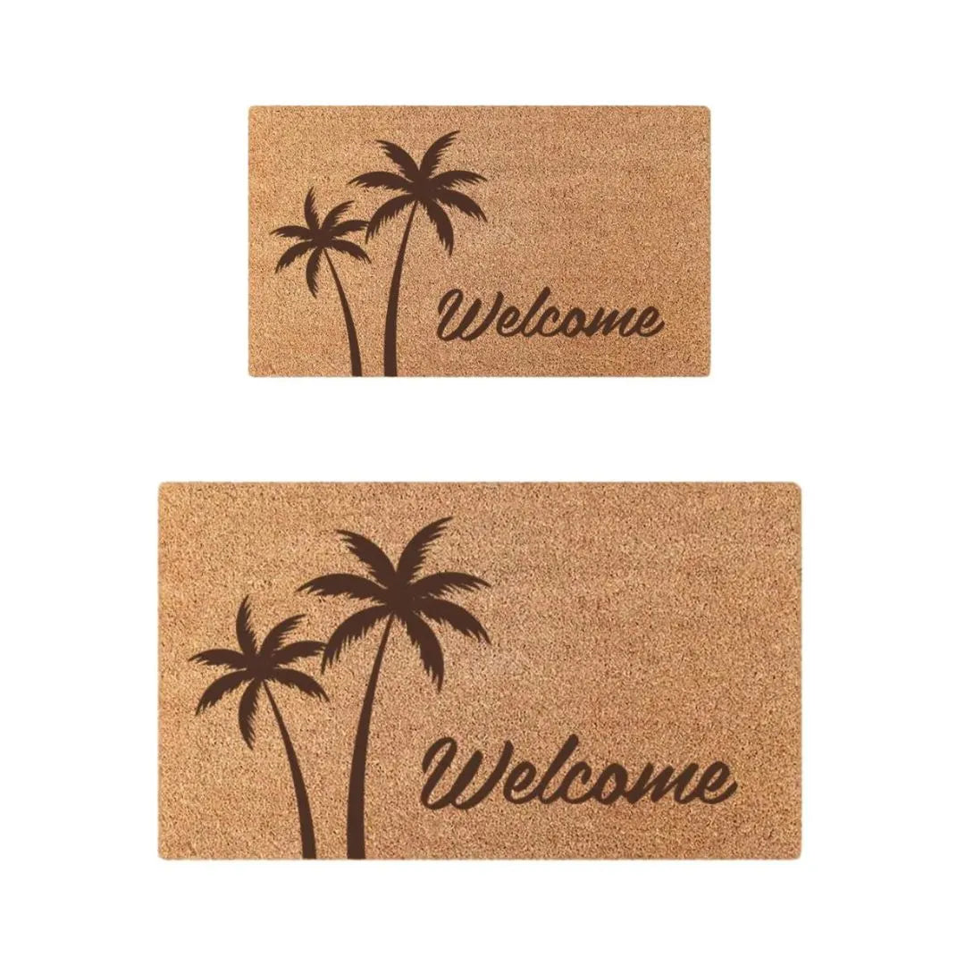 Two brown doormats with palm tree designs and 'Welcome' text on a white background