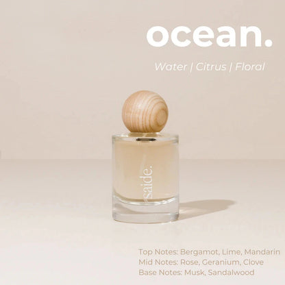 Perfume bottle with wooden cap on a beige background, featuring the brand 'sable'.