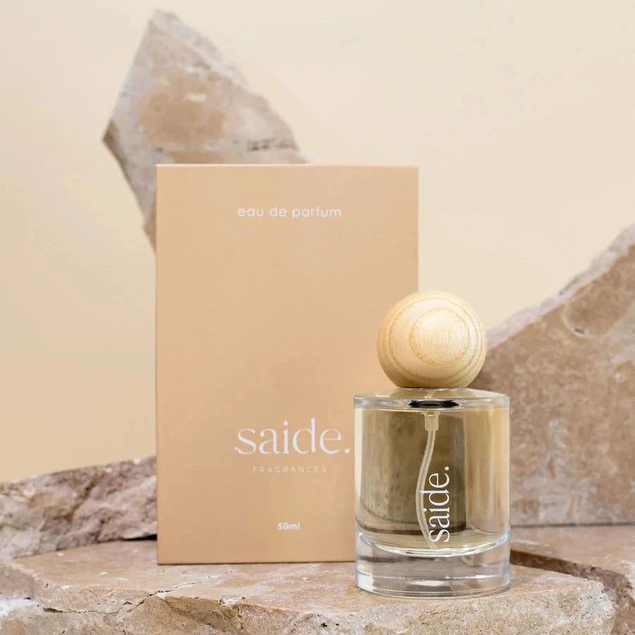 Saide perfume bottle and packaging on a stone surface with a neutral background from Sun Republic