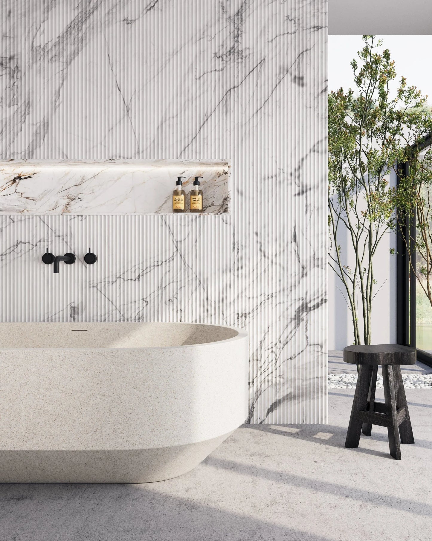 Modern bathroom with marble wall, freestanding bathtub, and outdoor view