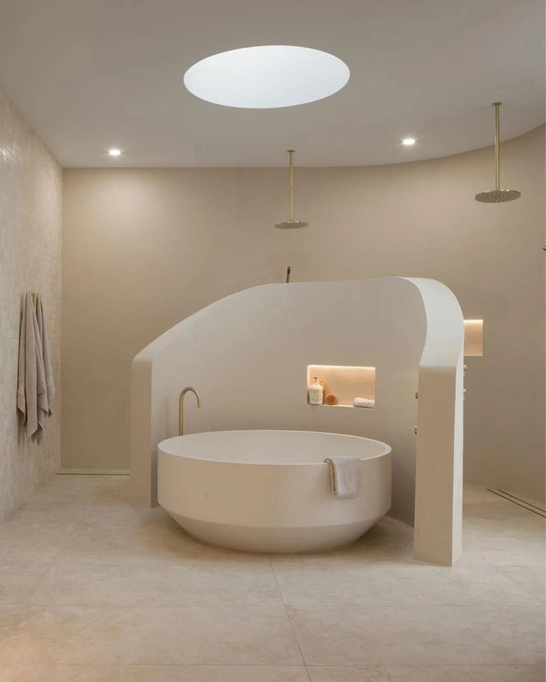 Modern bathroom with a freestanding bathtub and minimal decor.