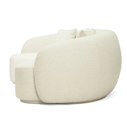 Off white colored linen curved sofa on a white background