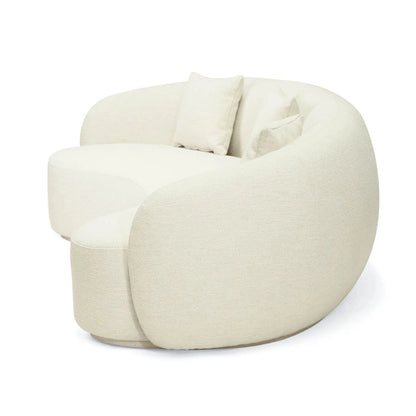 Off white colored linen curved sofa on a white background
