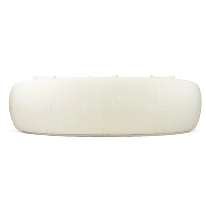 Off white colored linen curved sofa on a white background