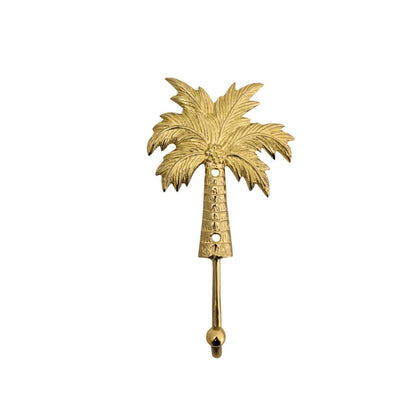 Gold palm tree-shaped hook on a white background