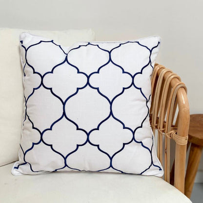 Decorative pillow with geometric pattern on a white couch