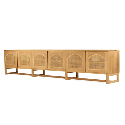 Wooden entertainment unit with rattan doors on a white background