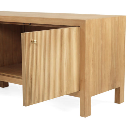 A modern light teak wood entertainment unit with four cabinet doors and tapered legs, shown against a plain white background.