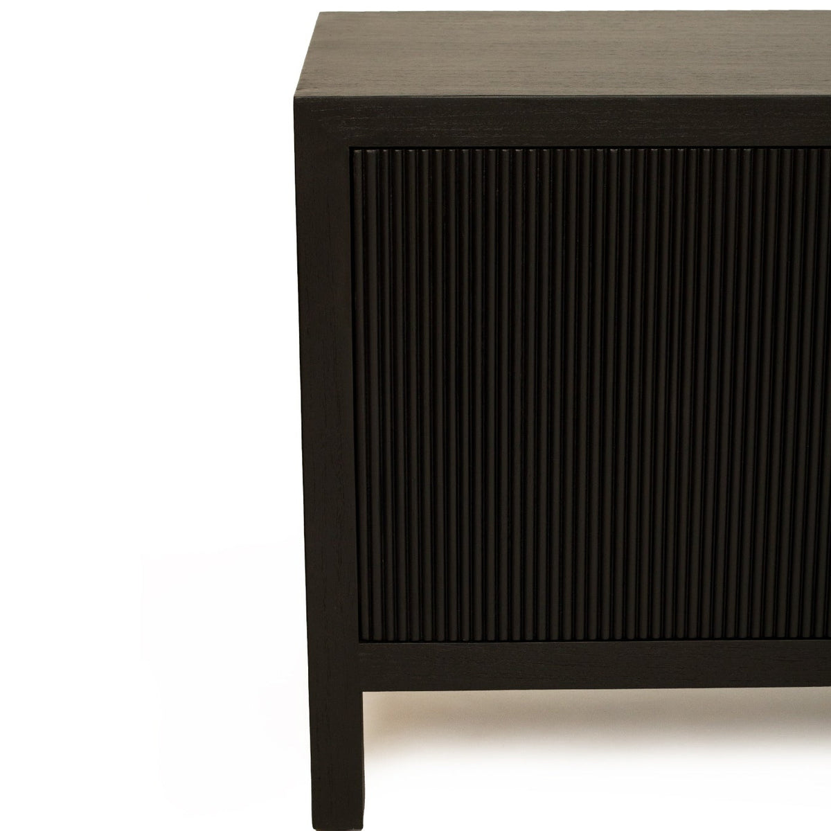 Close-up of a dark wood cabinet or sideboard with a vertically fluted front panel, shown against a plain white background.