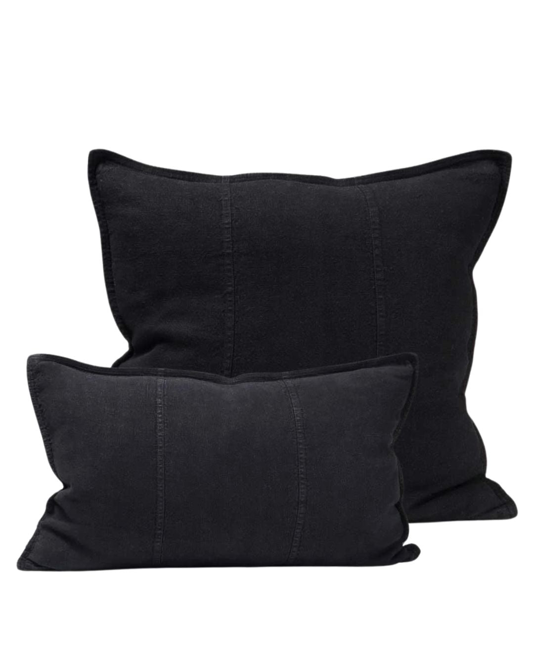 Two black pillows on a white background