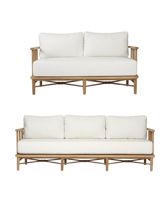 Two wooden sofas with white cushions on a white background