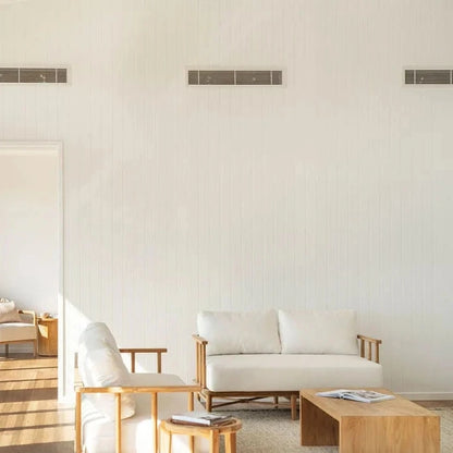 Modern living room with white furniture and wooden floor