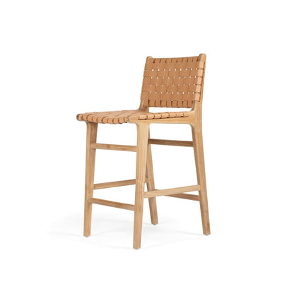 A natural tan nude-colored woven leather and teak wood counter stool with a flat, seat and a straight, sturdy teak frame.