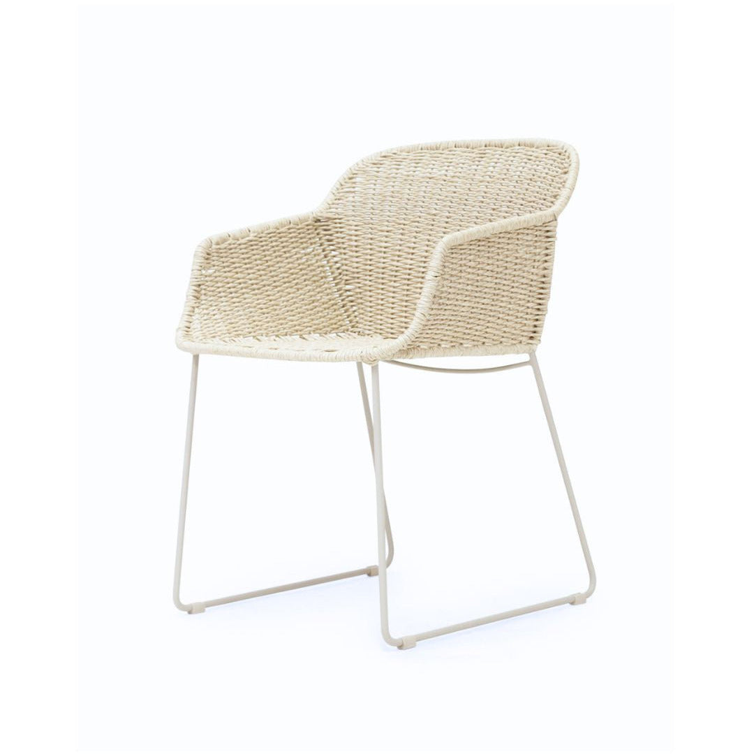 A modern outdoor armchair with a woven natural rattan seat and backrest, supported by a slim white metal frame, shown against a plain white background.
