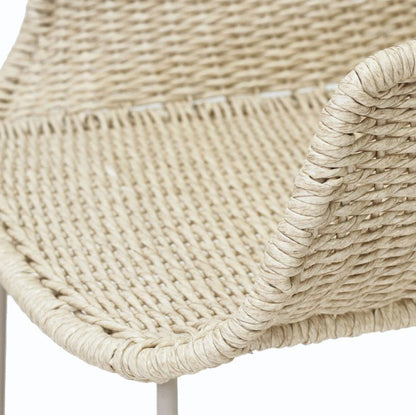 Close-up detail of a woven outdoor chair seat in a natural beige jute or seagrass material, showing the tight texture and curved armrest edge, on a white background.